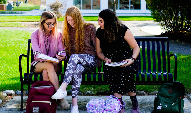 swissabc.net three female students studying on a bench on camp at Ocean County College